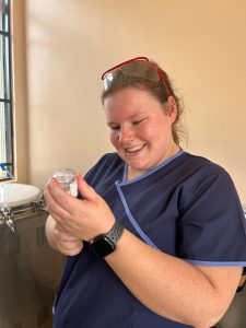 A Bridge2Aid volunteer dental nurse prepares local anaesthetic